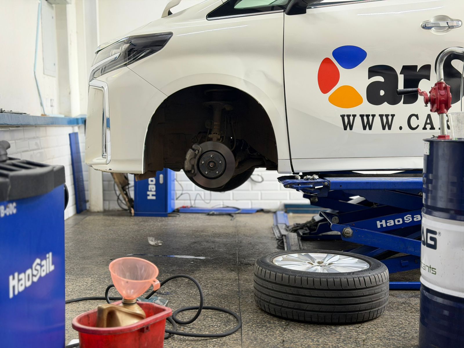 Vehicle on a lift for brake and mechanical maintenance