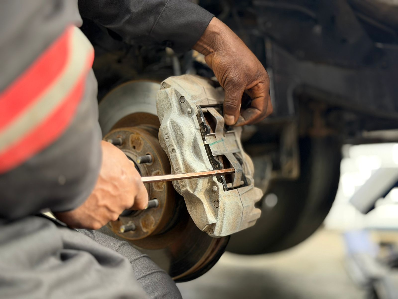 Mechanic changing brake pads