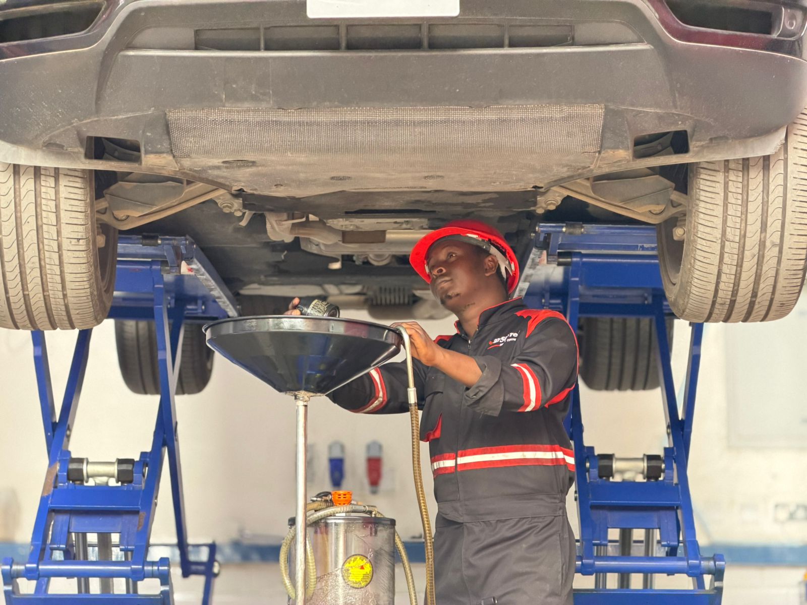 Vehicle serviced on a lift during an oil change
