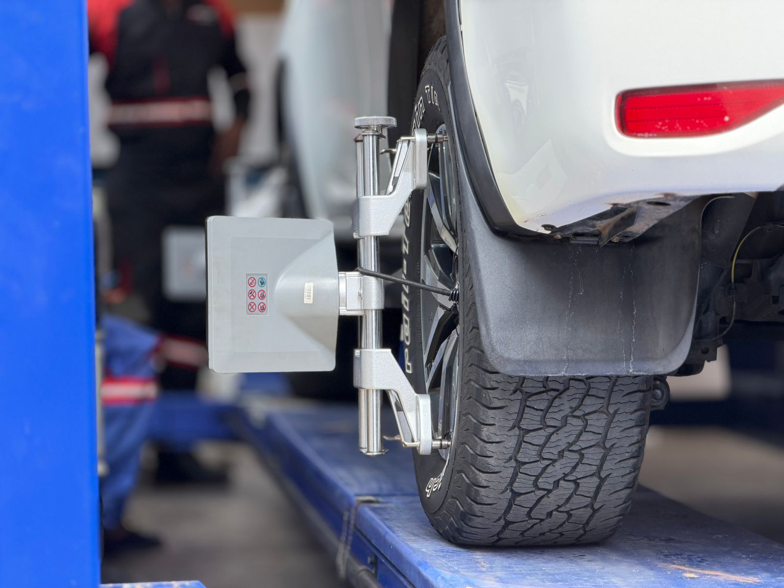 Computerised wheel alignment equipment fitted to a wheel
